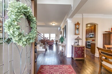 Two story entry with leaded glass front door
