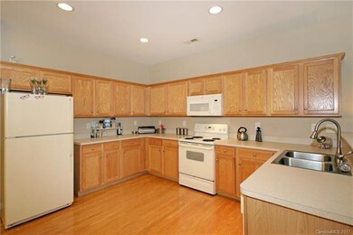 Hardwood in kitchen and throughout open area.