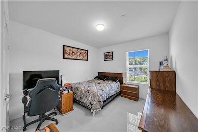 Bedroom with concrete flooring