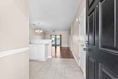 Entrance foyer featuring crown molding, ceiling fa
