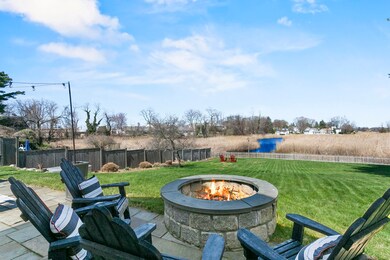 Built-in fire pit with beautiful water views make 