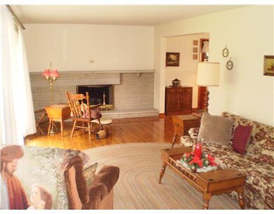Living Room. Large living room has a log fireplace