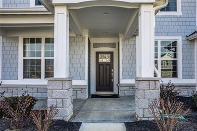 Beautiful front entry covered porch. Room for a hanging swing and sipping on coffee in a rocking chair
