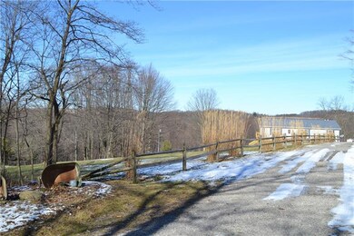 View from beginning of driveway.  Nice fence with 