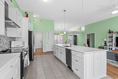 Kitchen with appliances with stainless steel finis