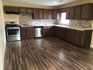 New stove/range, vent hood, dishwasher and garbage