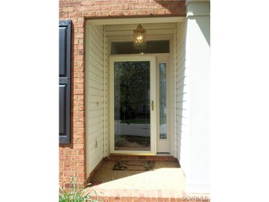 The glass storm door, transom window, and side lig