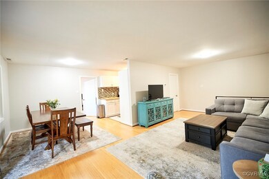 Living room with light hardwood / wood-style flooring