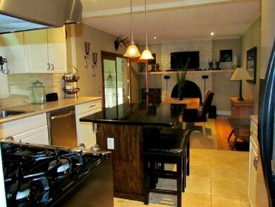 Kitchen. Open kitchen and dining with fireplace