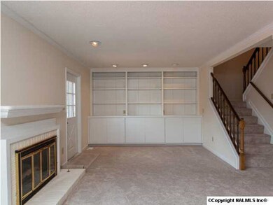 Family Room has fireplace and access to deck.