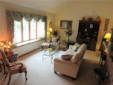 Relax in the bright, sunken living room featuring 