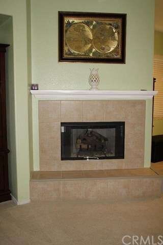 Beautiful fire place shared with family room dinin