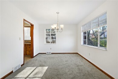 Dining room with large windows.