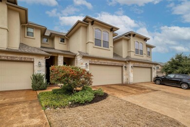 View of property featuring stucco siding, stone s