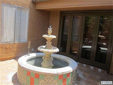 private courtyard entry with fountain