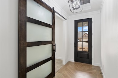 Entryway with a barn door, baseboards, an inviting