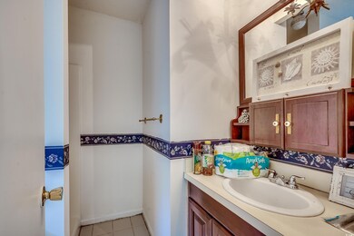 Bathroom with vanity and tile patterned flooring