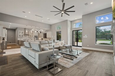 Step into your new home and be welcomed by a breathtaking open-concept living space, where soaring ceilings create an atmosphere of grandeur and elegance.