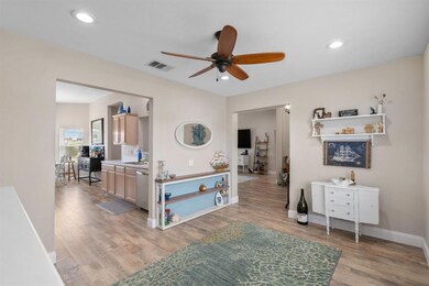 Formal Dining looking back into the kitchen area and into the living room.