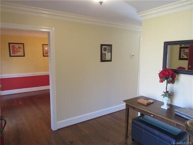 Foyer and entry to dining room with hardwood floor
