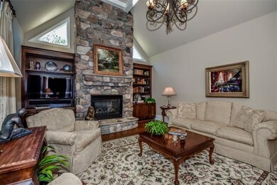 Warm and inviting Great Room with a stone fireplac