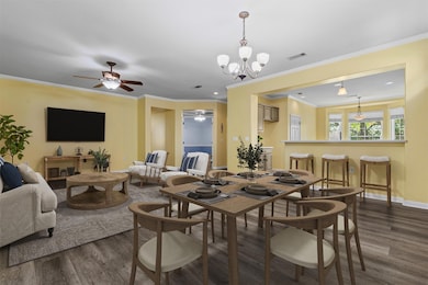 Dining area with dark wood-type flooring, ceiling