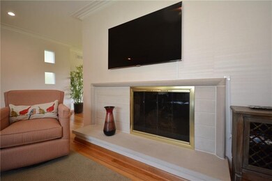 The fireplace in the living room is sleek with its