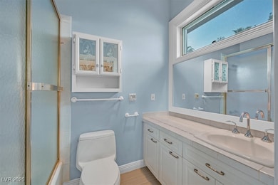 Bathroom featuring vanity and combined bath / shower with glass door