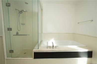 Bathroom with shower with separate bathtub