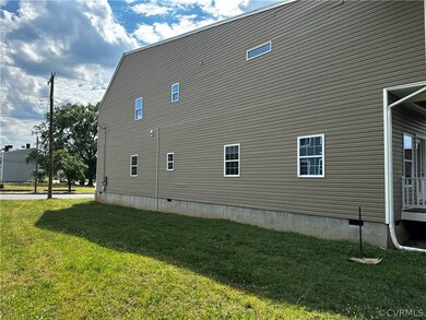 View of side of property with a yard