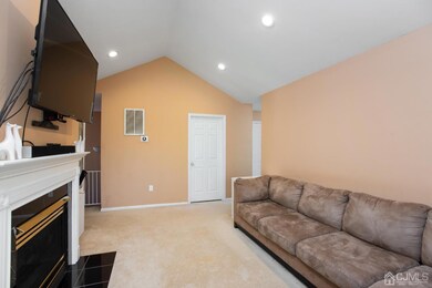 Living Room with cathedral ceiling and recessed lighting