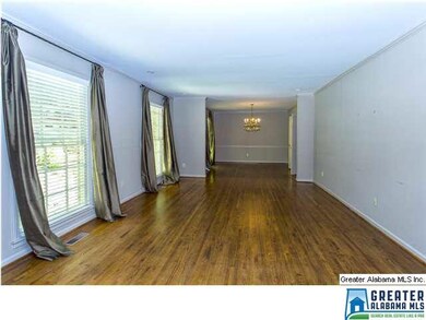 Large living room with floor-to-ceiling windows - 