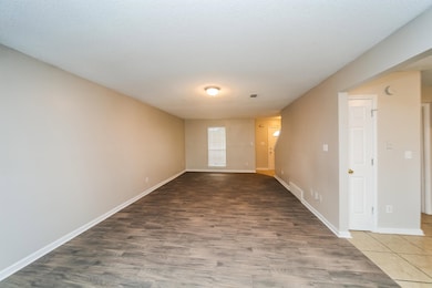 Spare room with wood finished floors and baseboards