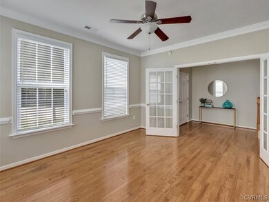 Office/study with French doors, crown molding and