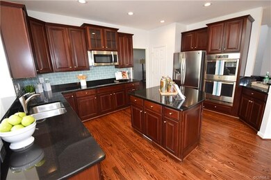 Gorgeous kitchen with island. It features granite 