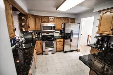 Granite counters, ceramic tile floors, glass back 
