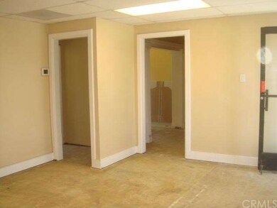 LIVING ROOM WITH ENTRANCE INTO ROOMS AND BATHROOM 