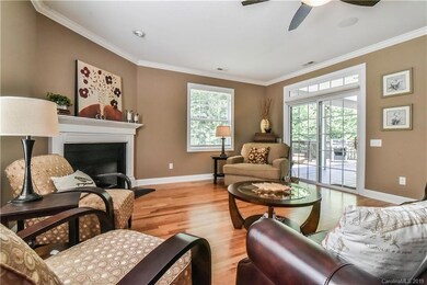 Living room with entry to partially covered back porch.