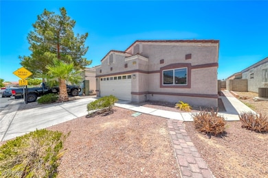 View of front of home with a garage, stucco siding