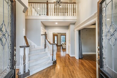 Grand foyer with two story ceilings.