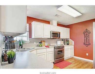 Kitchen. Stainless steel appliances, an oversized pantry, and ample cabinetry add to the appeal of this kitchen.