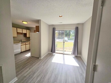 Interior space featuring sink, a textured ceiling,