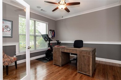 Light and airy office, den or ? with decorator details and access to full bath on main level.