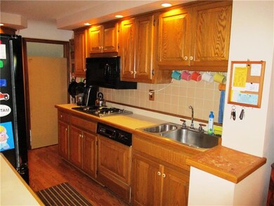 Galley style kitchen with plenty of cabinetry.