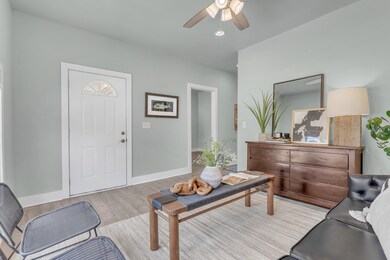 View of front door leading to the adorable front porch~