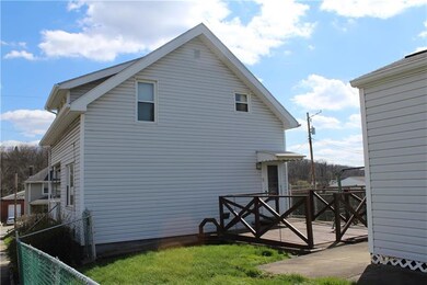 Side View with Deck and Fenced Yard