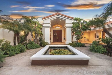 Gated courtyard entrance with koi pond
