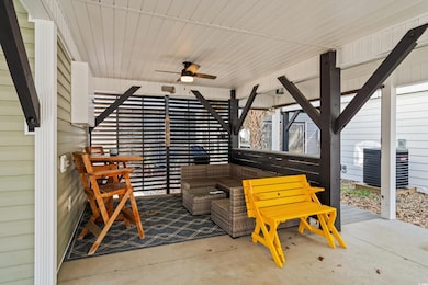 View of patio featuring central AC and a ceiling f