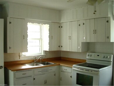 Spacious eat-in kitchen includes range and garbage