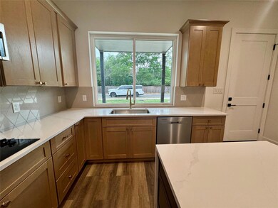 Kitchen with stainless steel dishwasher, tasteful